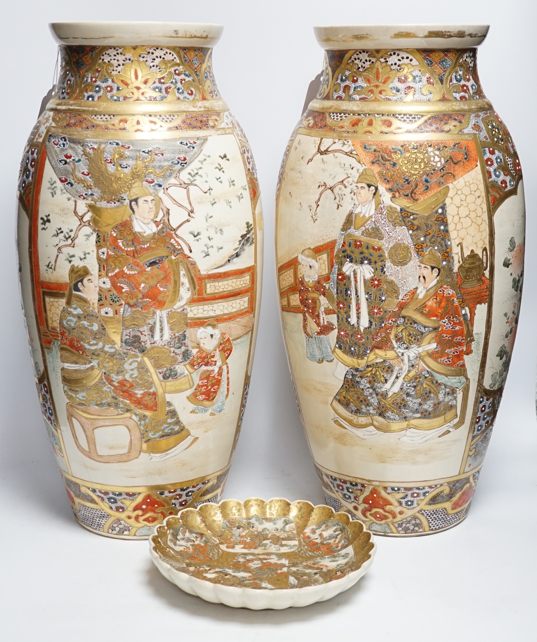 A pair of late 19th century Satsuma ovoid vases and a Satsuma circular fluted dish, (3) vases 47cm high